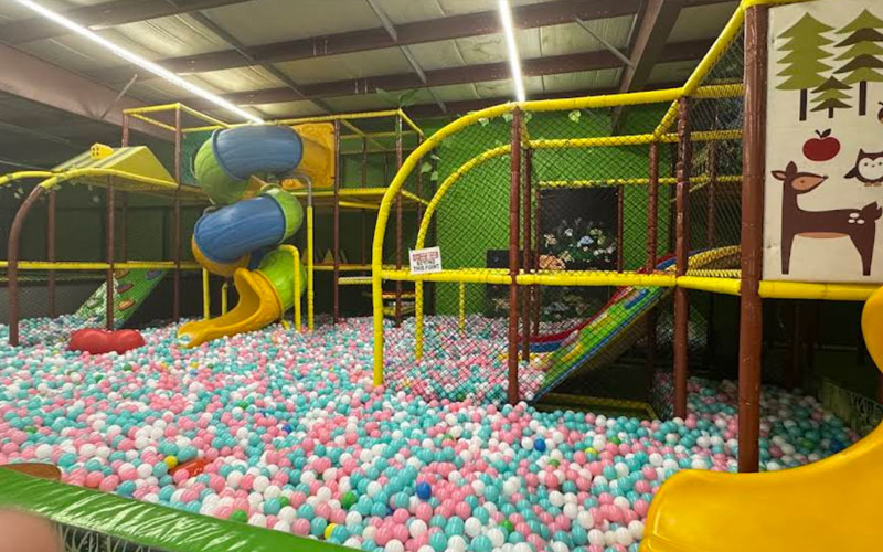Indoor play place equipment with slides and ball pits