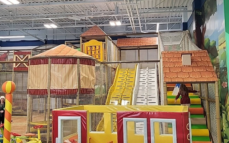 Toddler play equipment with slides and ball pits